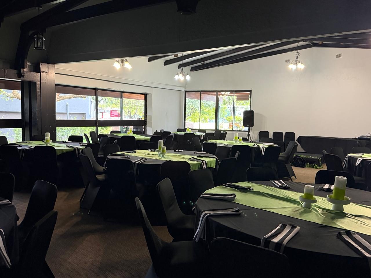 Tables set in green & black — L'Affaire Events